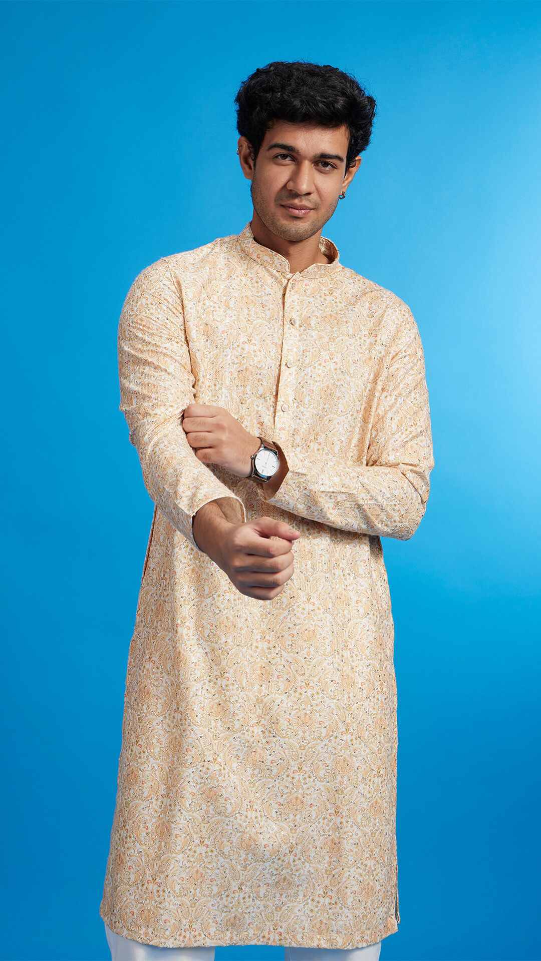 A man in printed white kurta for holi